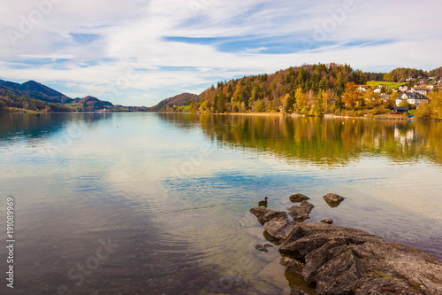 Alpine lake Fuschlsee in austrian Alps on sunny autumn day. Beautiful view from Fuschl am See town, Austria.