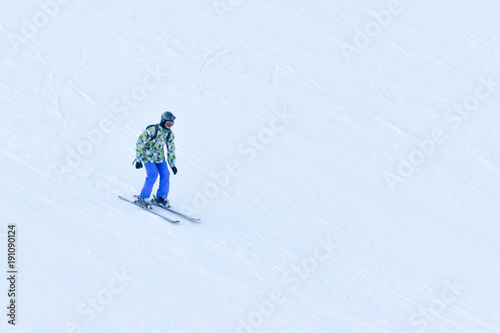 BUKOVEL, UKRAINE- 27 JANUARY 2018: Man skiing down the snow-covered slope