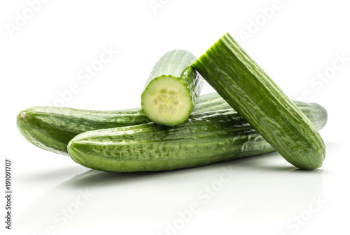 European cucumbers (burpless, seedless, hothouse, gourmet, greenhouse or English) set isolated on white background two whole and two fresh cut halves.