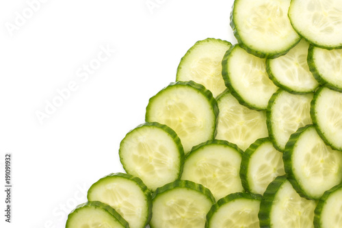 European cucumber slices background (burpless, seedless, hothouse, gourmet, greenhouse or English) isolated on white top view right side.