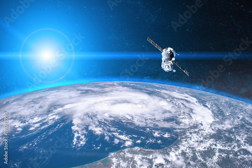 Blue planet Earth. Spacecraft launch into space. Elements of this image furnished by NASA. photo