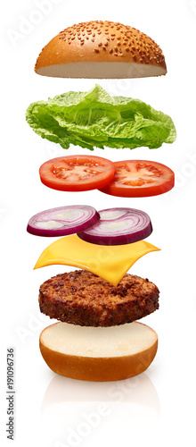 Hamburger with cheese, tomato, onions and lettuce on white