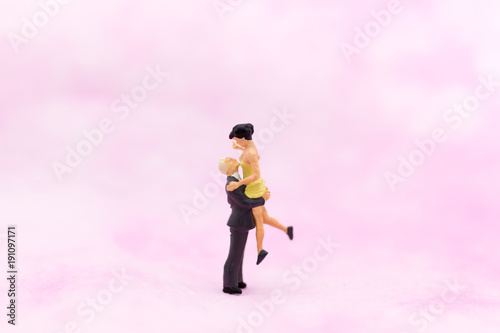Miniature people  Couple hug each other to show love. Image use for Valentine s day concept.