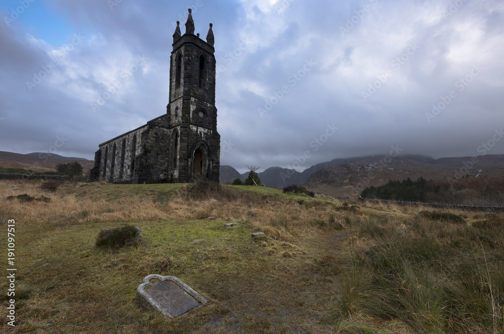 Dunlewey church sits abandoned in the gloomy atmosphere of Glenveagh National Park, Co. Donegal, Ireland.