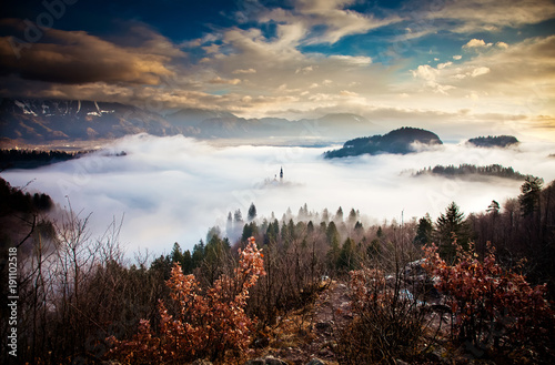 amazing view over lake Bled on a foggy morning from Ojstrica viewpoint, Slovenia, Europe - travel background