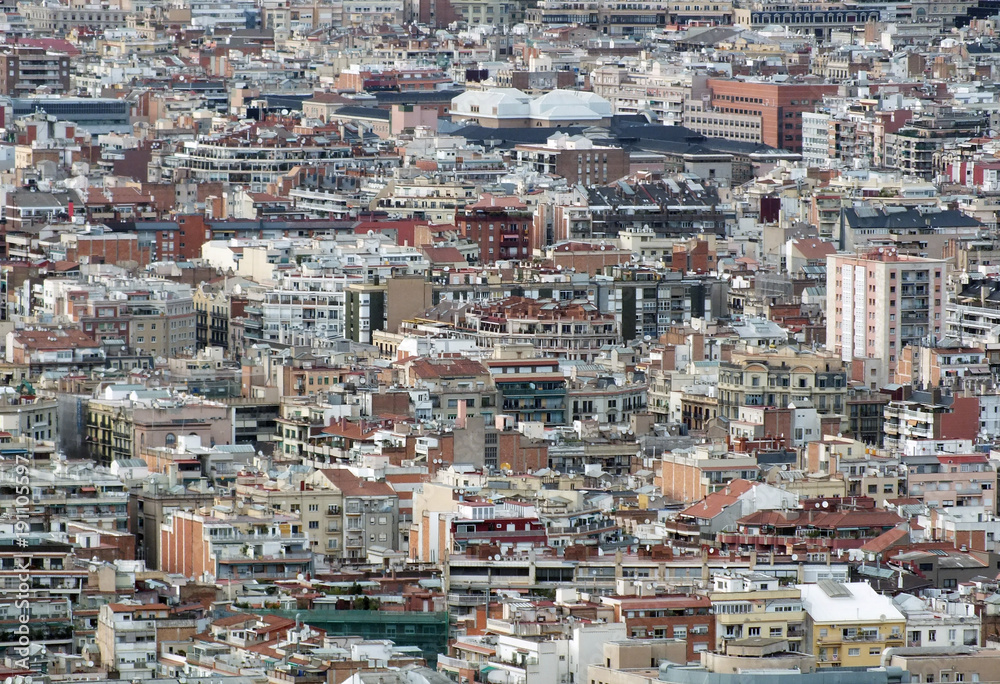 panoramic aerial urban landscape of barcelona showing residential and business districts with hundreds of buildings visible