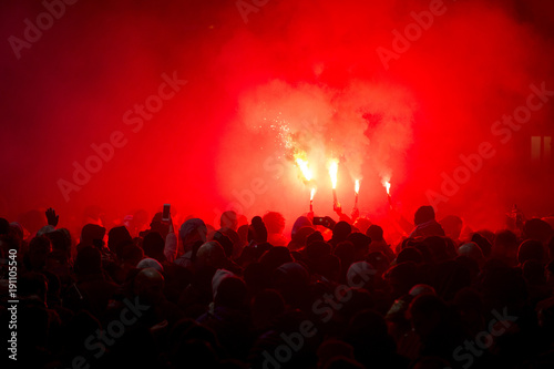 football fans lit up the lights and smoke bombs. revolution. protest photo