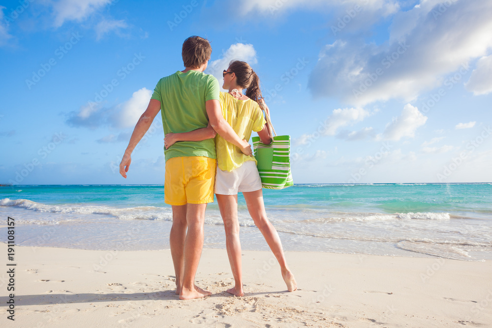picture of happy couple having fun at the beach picture of happy couple having fun at the beach