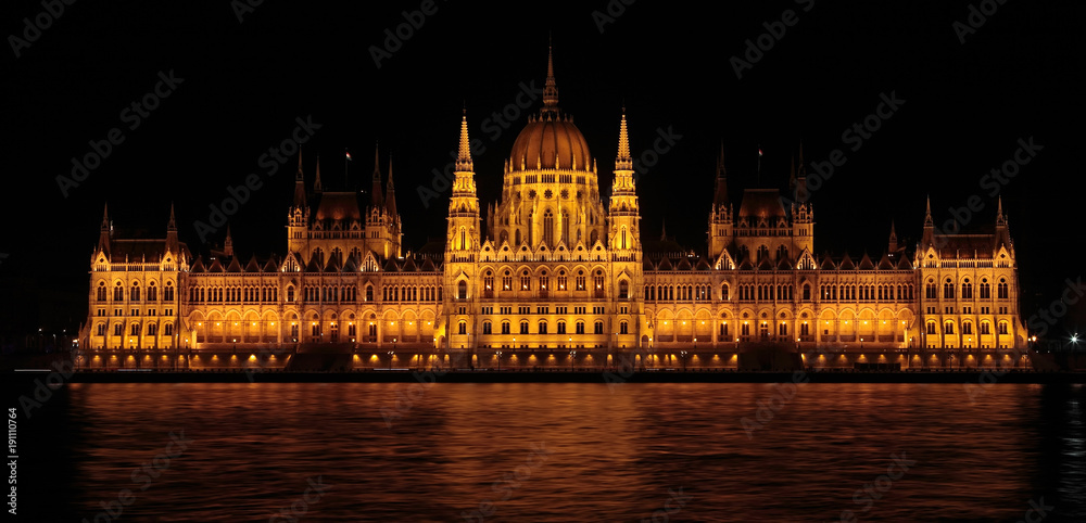The Parliament of Budapest by night, view from Danube river, Hungary, Europe