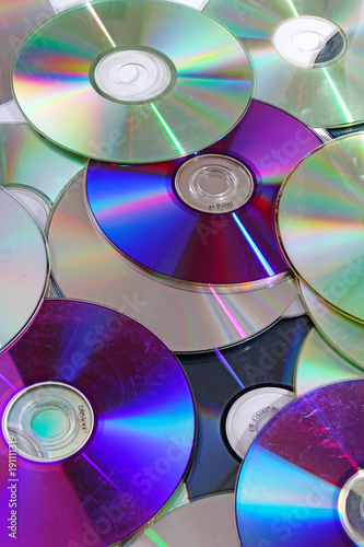 Fototapeta Cd,dvd reflective shiny cd dvds blue ray texture pattern.
