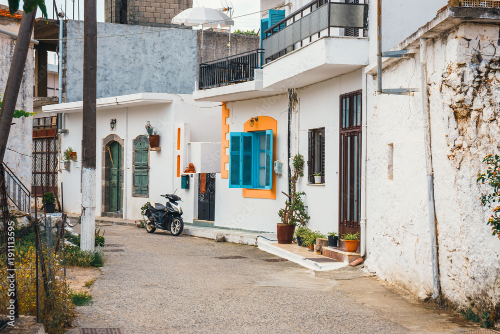 Narrow street in the small village, Crete Island, Greece