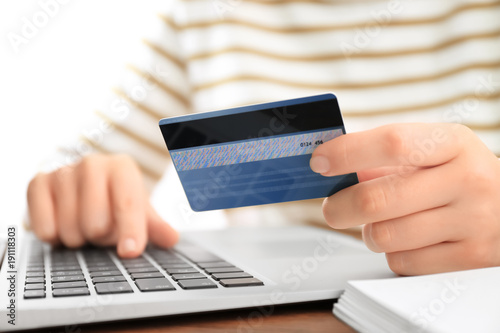 Woman with credit card and ...