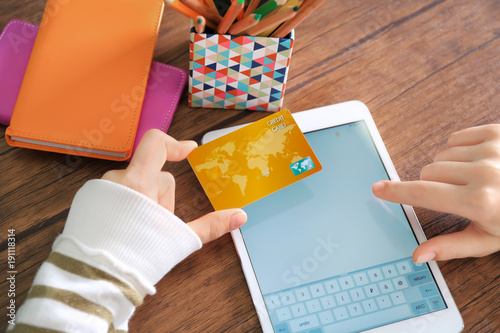 Woman with credit card and ...