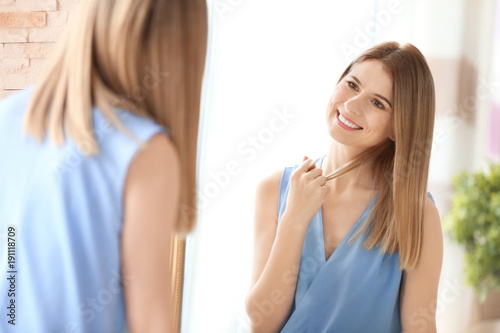 Young woman looking at hers...