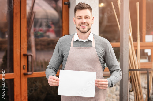 Business owner holding blan...