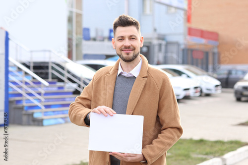 Business owner holding blan...