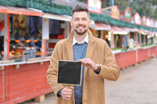 Business owner holding blan...