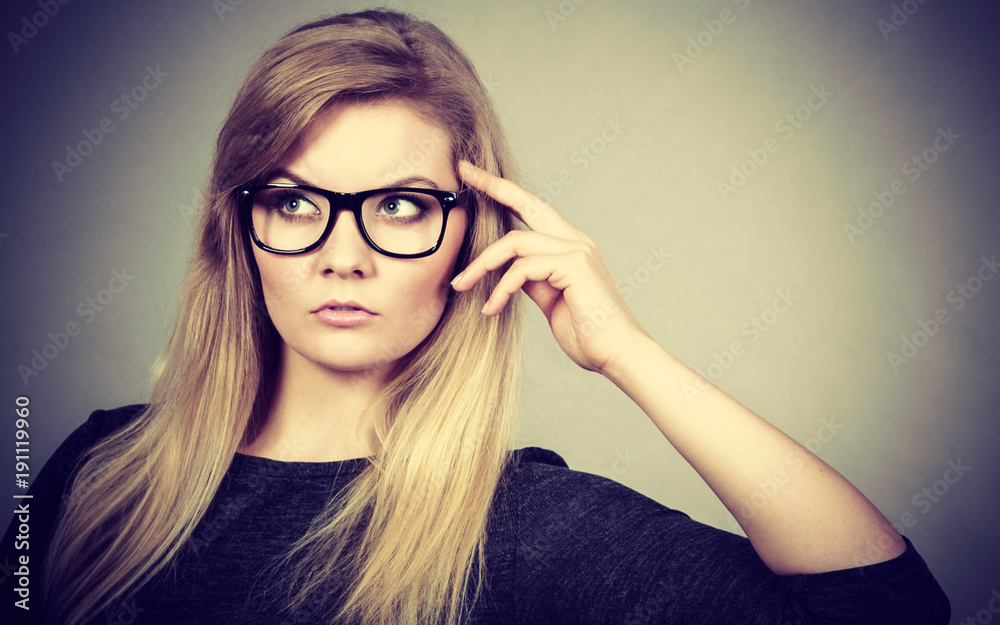 Closeup of woman thinking face expression Closeup of woman thinking face expression