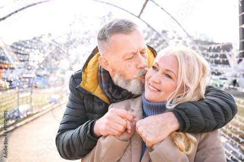 Happy mature couple hugging...