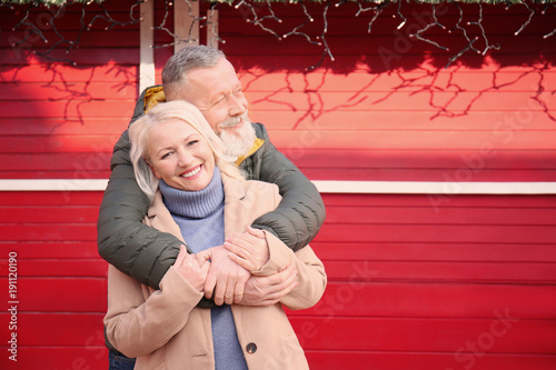 Happy mature couple hugging...