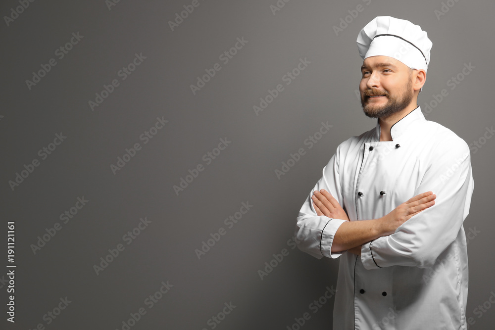 Handsome male chef on gray background Handsome male chef on gray background