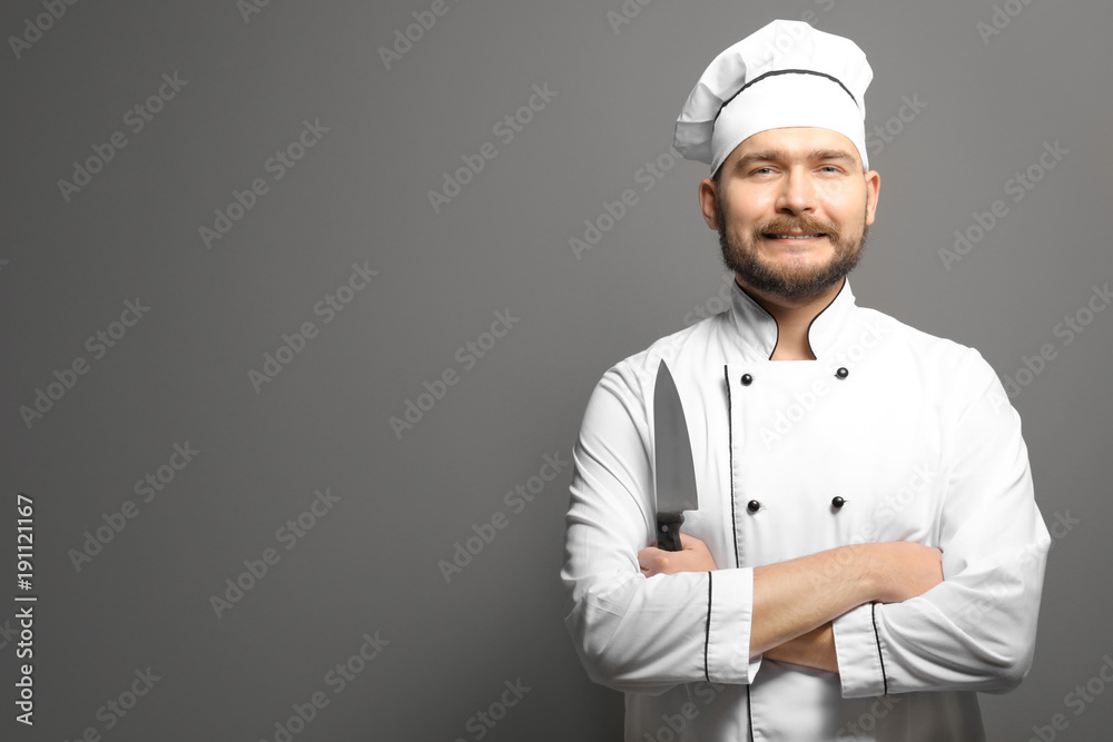Handsome male chef on gray background Handsome male chef on gray background