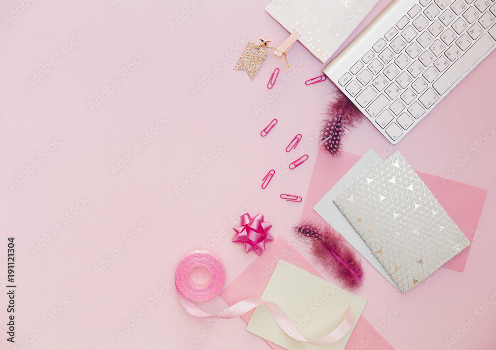 Flat lay, luxury feminine desk workspace on pink background.