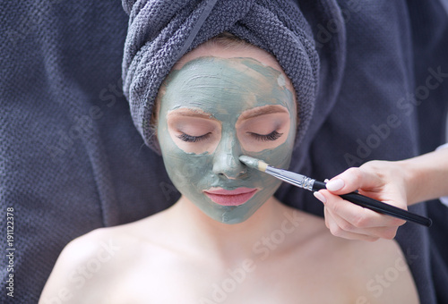 Beautiful woman having mask , lying on spa . Woman. Spa salon