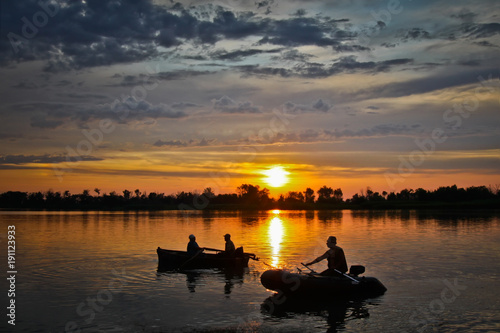 Fishermen at sunset return