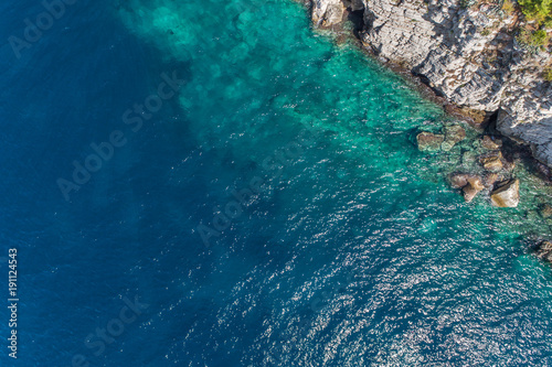 Aerial view of the rocky bottom of the Adriatic Sea covered with turquoise water