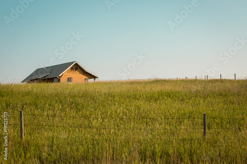 Lone house on a big summer field
