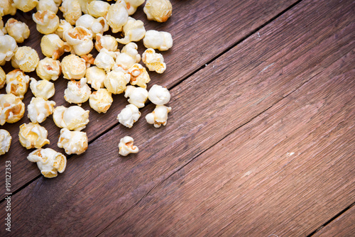 popcorn texture on a wooden table blackground