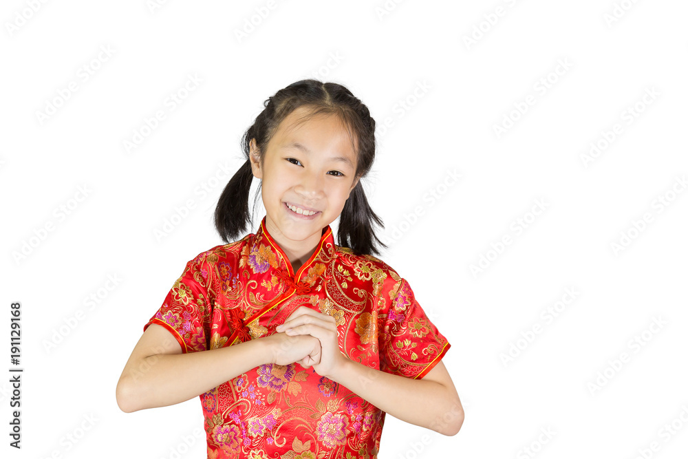 Asian girl wearing red Chinese suit on white background during traditional chinese new year festival,girl with congratulation gesture Asian girl wearing red Chinese suit on white background during traditional chinese new year festival,girl with congratulation gesture