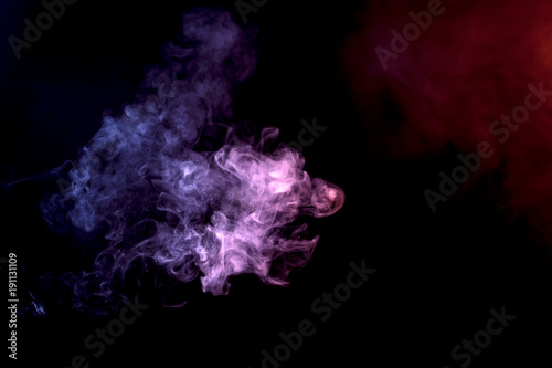Purple cloud of vape smoke on black isolated background © Виталий Сова