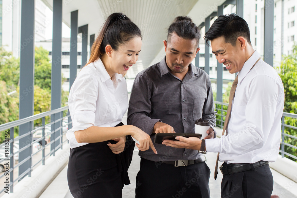 Start up business. people team work meeting point to discuss the graph up and down of economy and work on tablet.Selective Focus Start up business. people team work meeting point to discuss the graph up and down of economy and work on tablet.Selective Focus