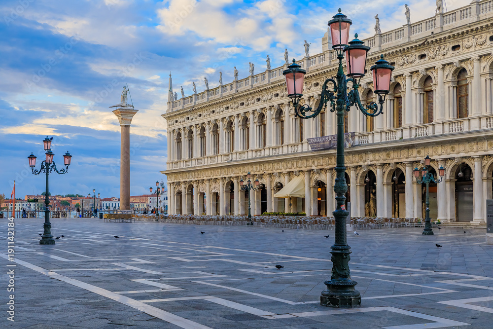 The picturesque Piazza St Marco or Saint Mark's square at sunrise in Venice Italy