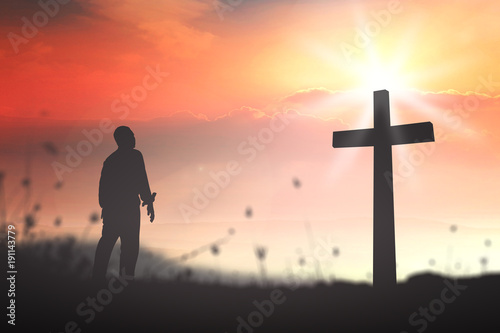 Tapeta Good Friday concept: Silhouette human standing over blurred crown of thorns and the cross on nature background