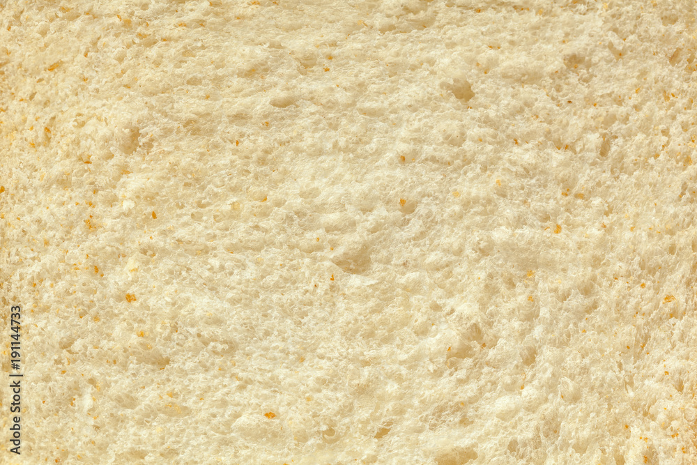 Background of a slice of freshly baked white bread close-up.