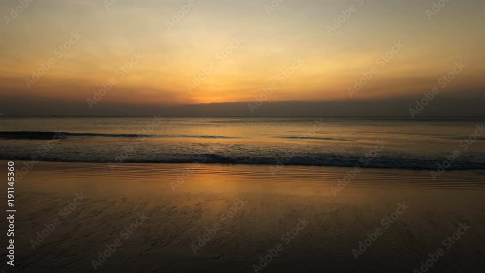 Beautiful golden sunset at the sandy beach at the end of a beautiful summer day Beautiful golden sunset at the sandy beach at the end of a beautiful summer day