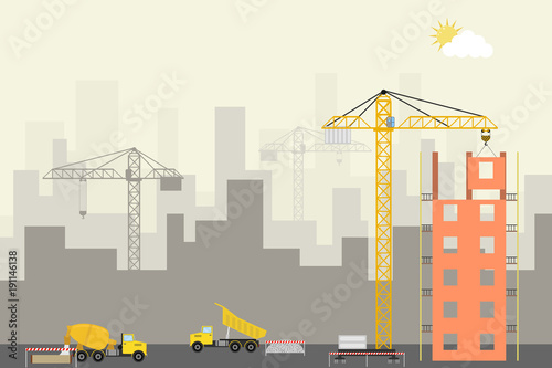 Modern building construction. Construction site with a crane, concrete truck and dump truck.