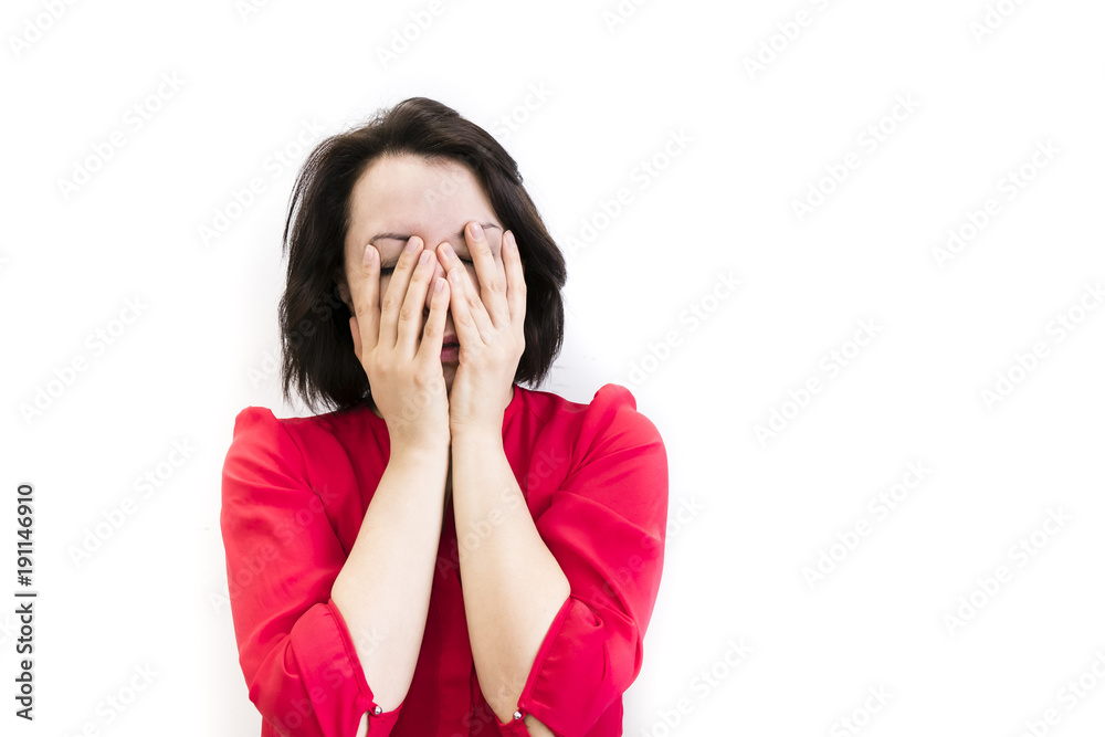 brunette girl is bored, dressed in red, isolated on white background brunette girl is bored, dressed in red, isolated on white background