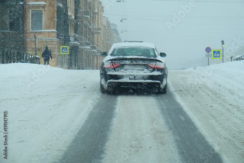 snowfall on the roads of the modern big city © sergeevspb