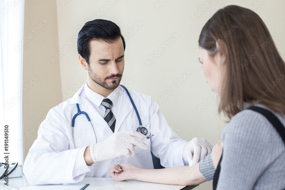 Doctor inject woman at hospital. People with medical concept. Doctor inject woman at hospital. People with medical concept.
