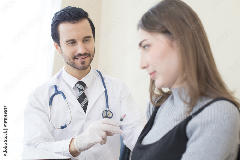 Doctor inject woman at hospital. People with medical concept. Doctor inject woman at hospital. People with medical concept.