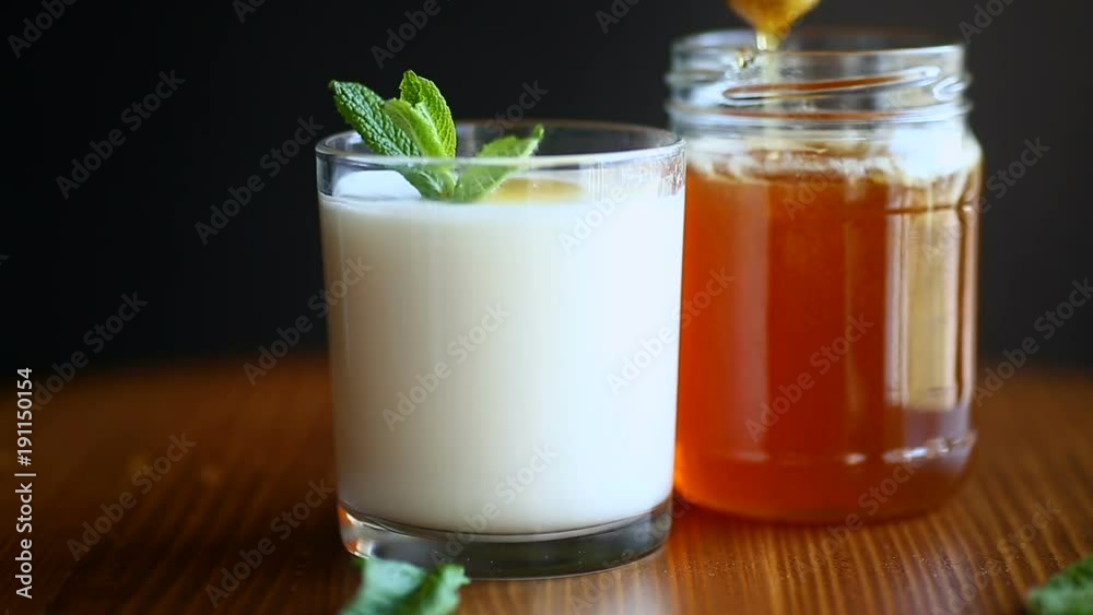 sweet homemade yogurt with honey on a wooden table sweet homemade yogurt with honey on a wooden table