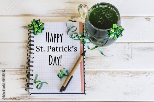 Notebook with Green Beer  Green Ribbons and Happy Saint Patrick s Day Text