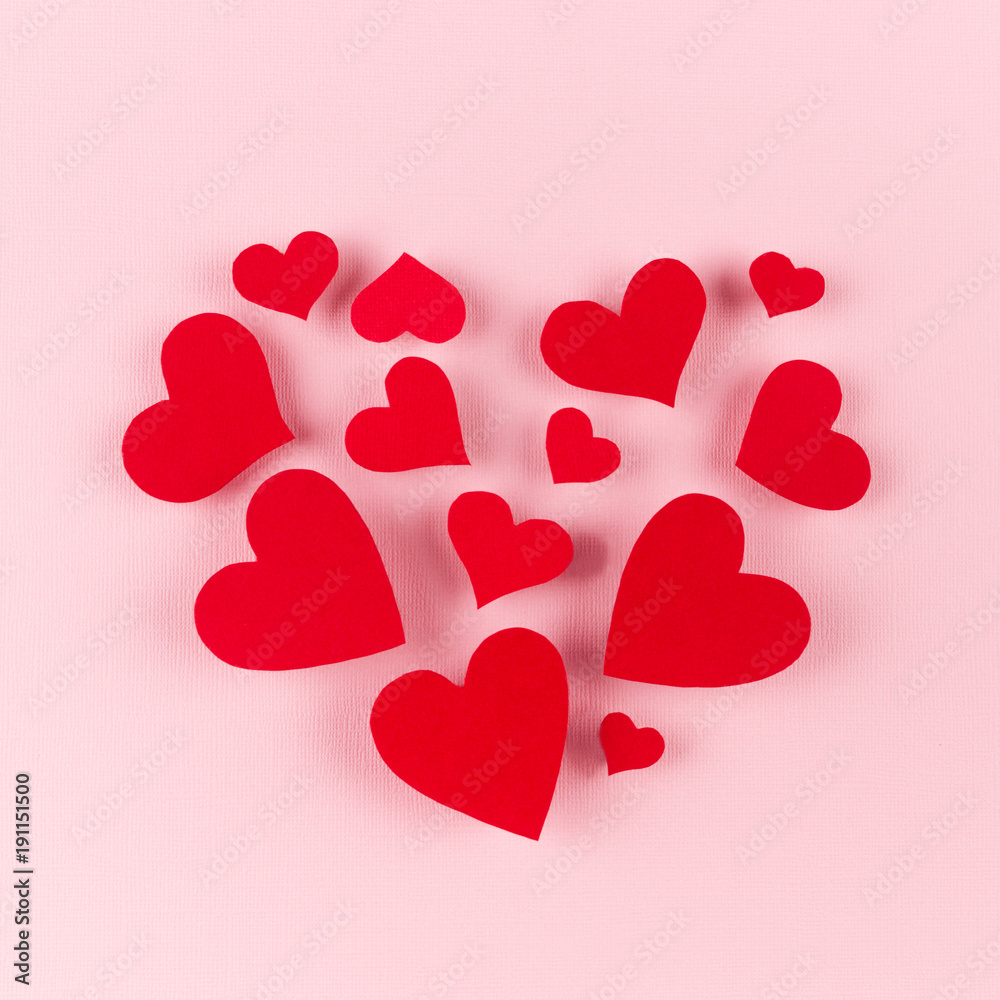 Big heart of soar red hearts on soft pink color background. Concept fof Valentine day.