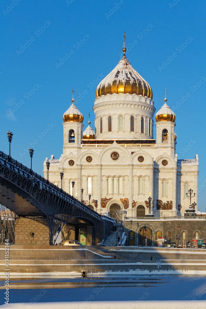 Cathedral of Christ the Saviour on Patriarshiy Bridge background against the blue sky. Moscow in winter
