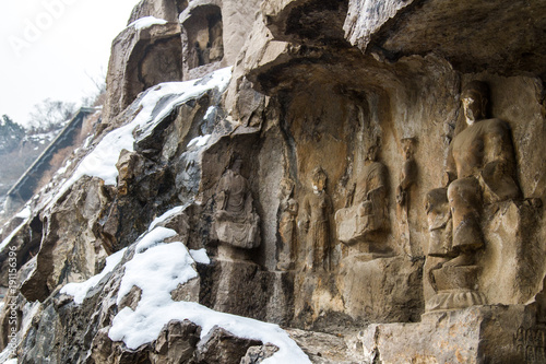 Close-up Stone Buddha Statue Carved from the mountains in winter