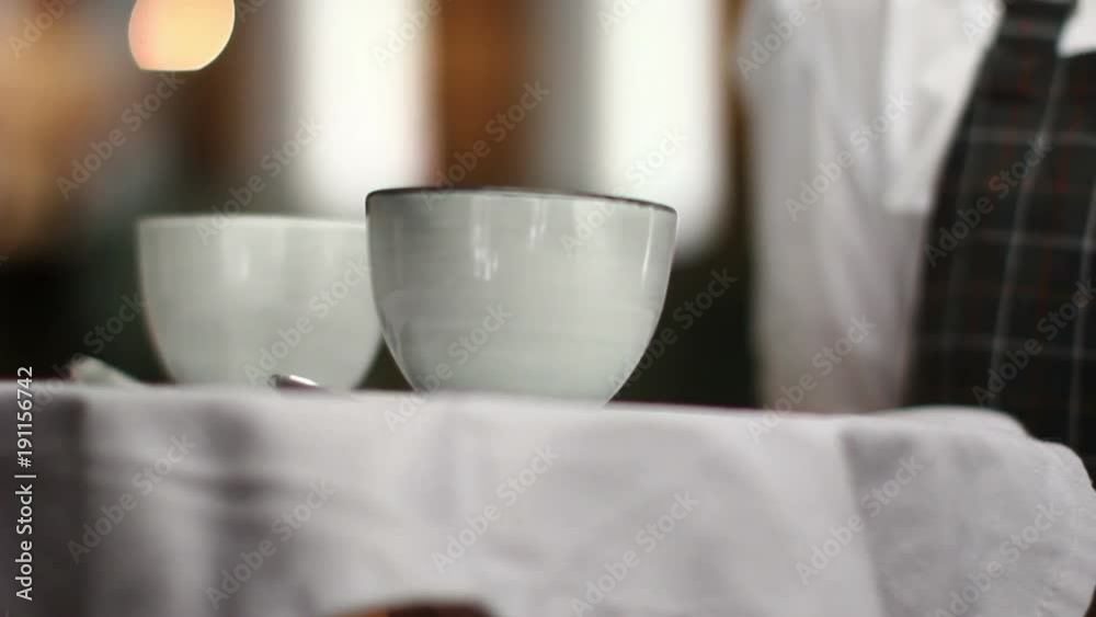 Crop server carrying tray wit coffee Crop server carrying tray wit coffee